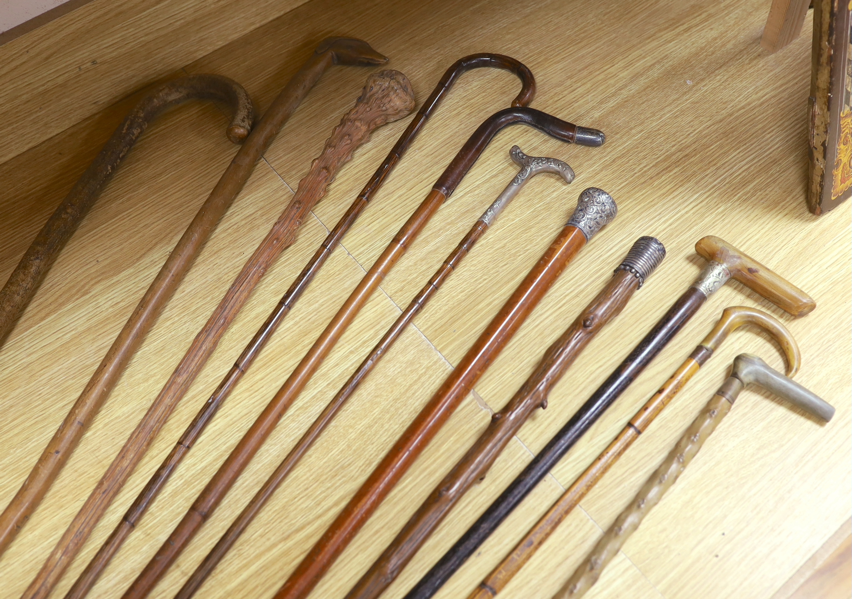 Four various decorative Victorian silver mounted walking sticks/canes, three horn handled canes and four others